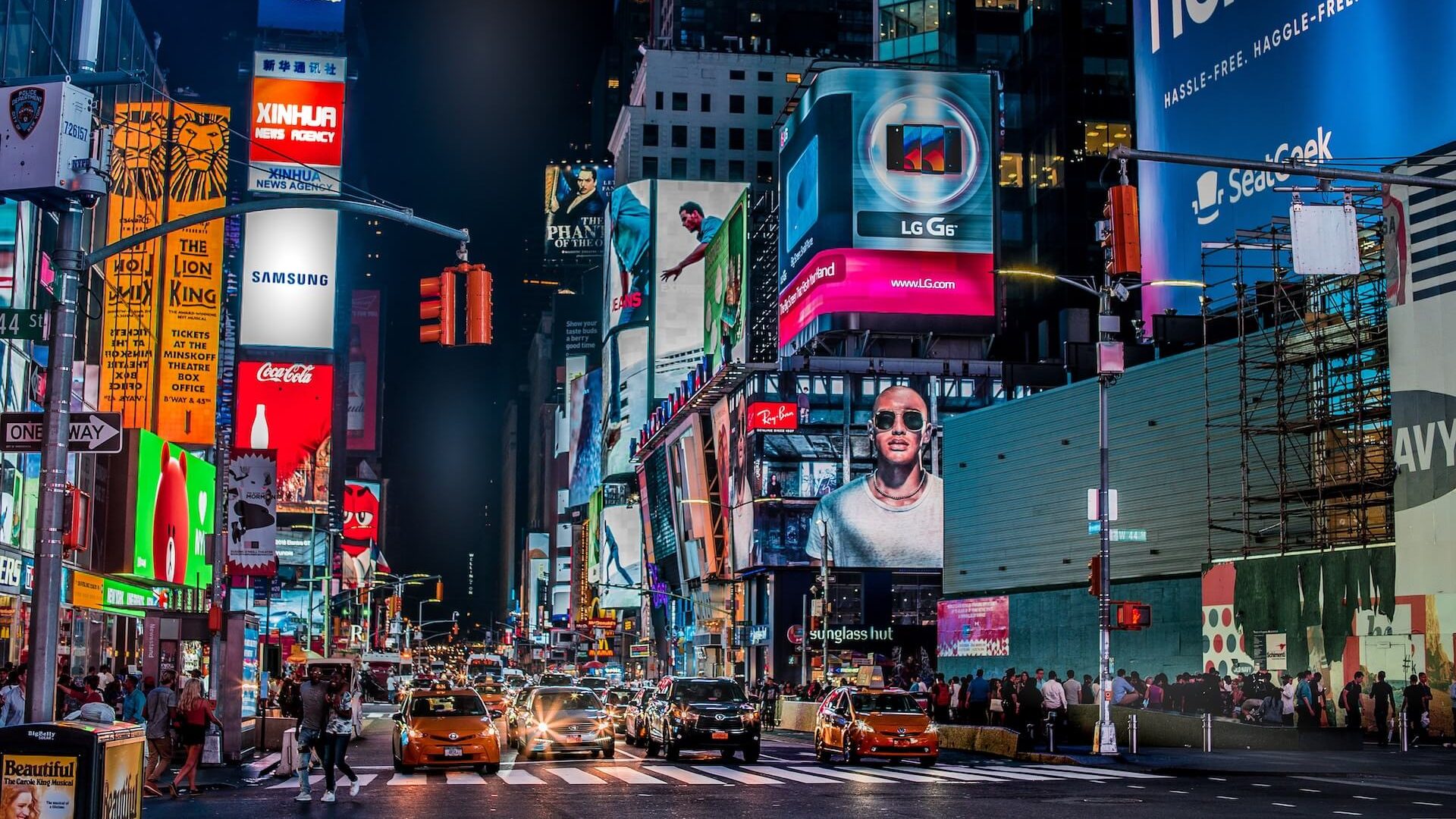 A bustling view of New York City's Times Square, known for its bright lights, billboards, and energetic atmosphere.